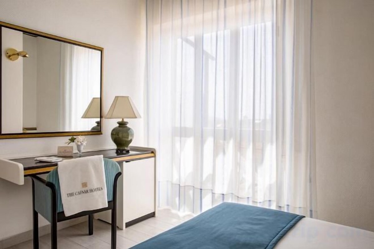 Minibar, desk, blackout curtains, bed sheets