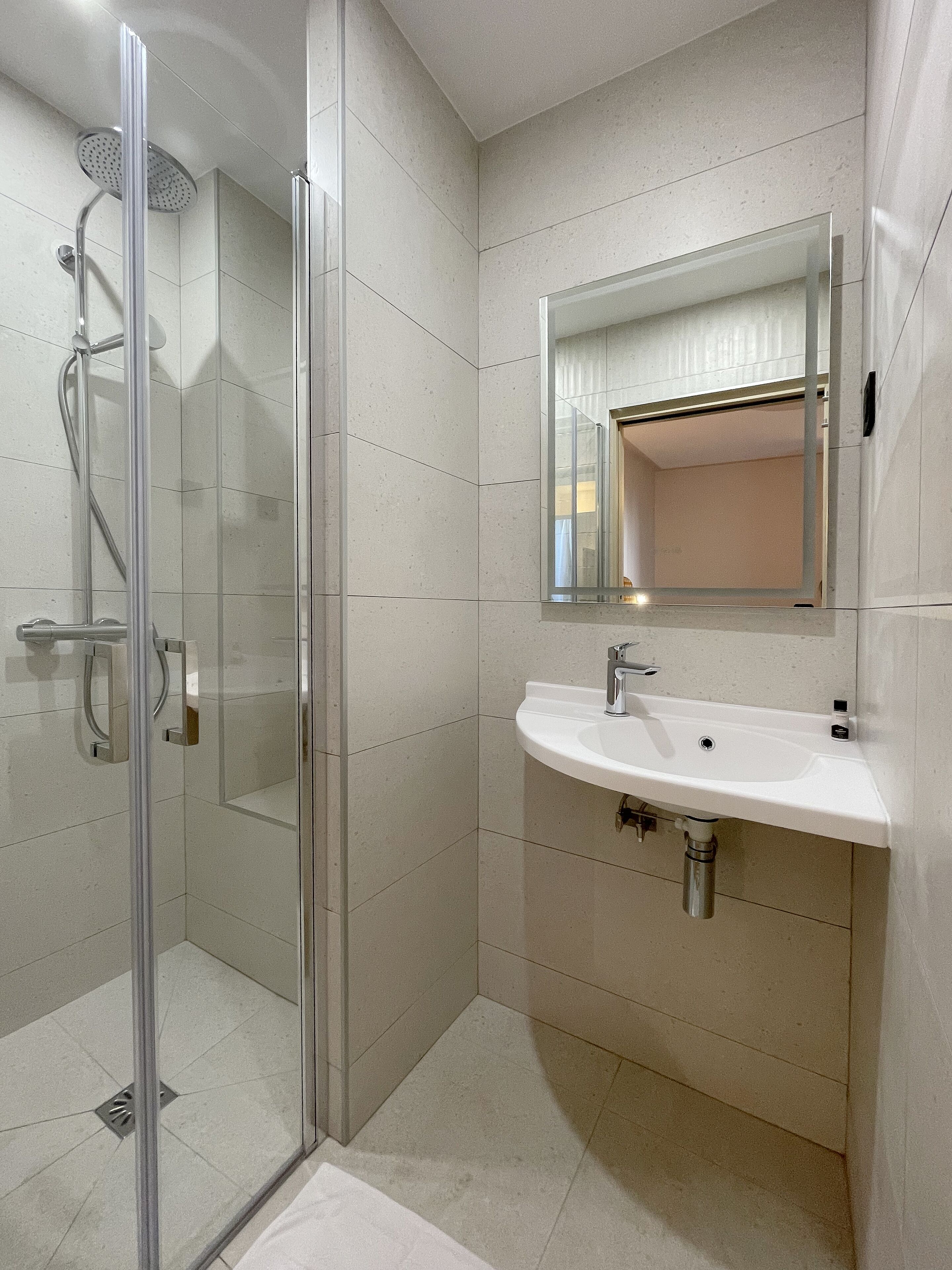 shower, rainfall showerhead, designer toiletries, hair dryer