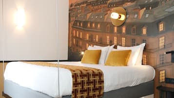 Deluxe Room | Select Comfort beds, in-room safe, individually decorated, desk