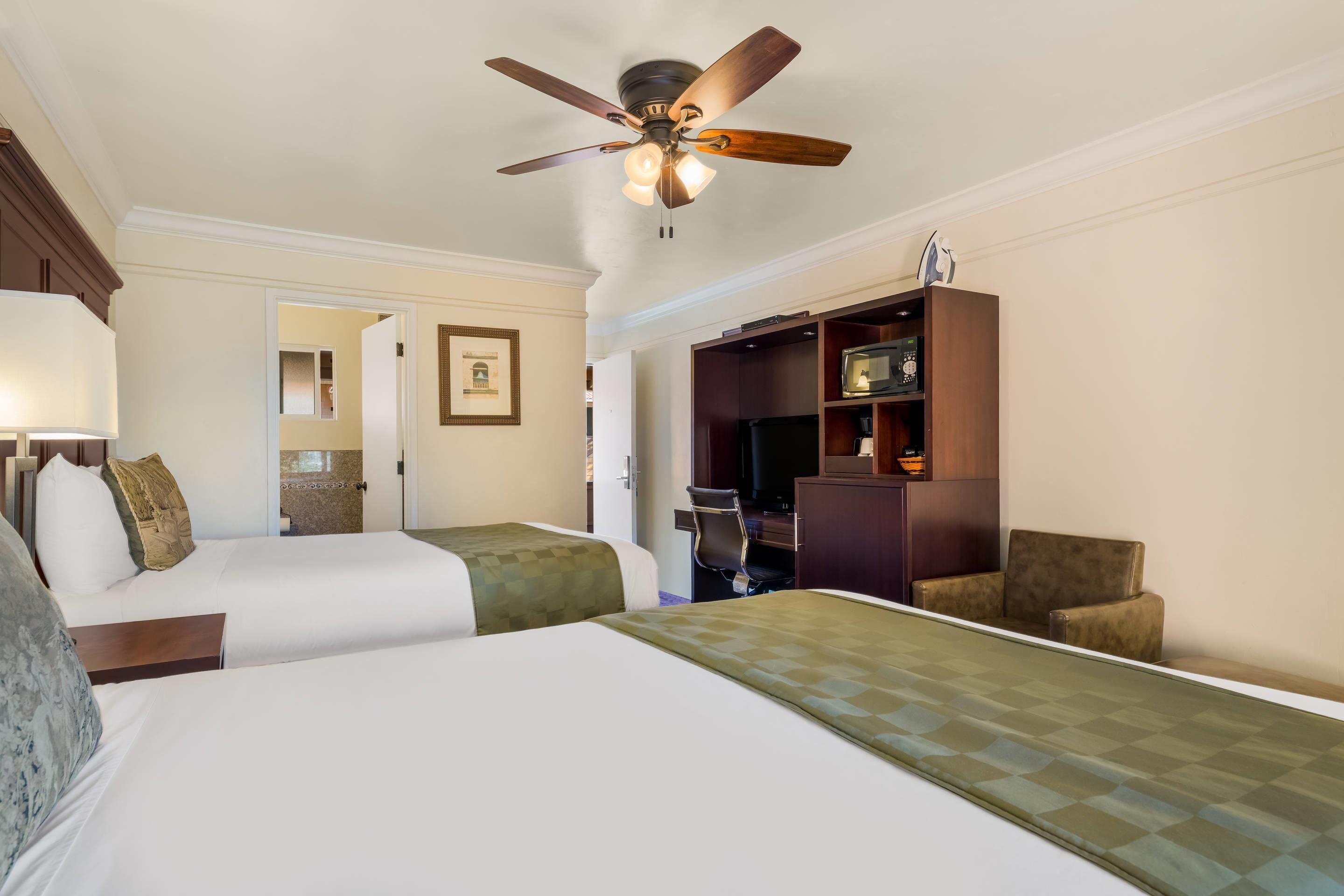 Premium bedding, pillow-top beds, desk, laptop workspace