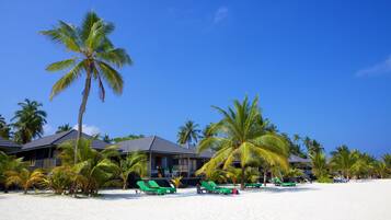 On the beach, white sand, beach towels, water skiing
