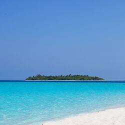 On the beach, white sand, beach towels, waterskiing