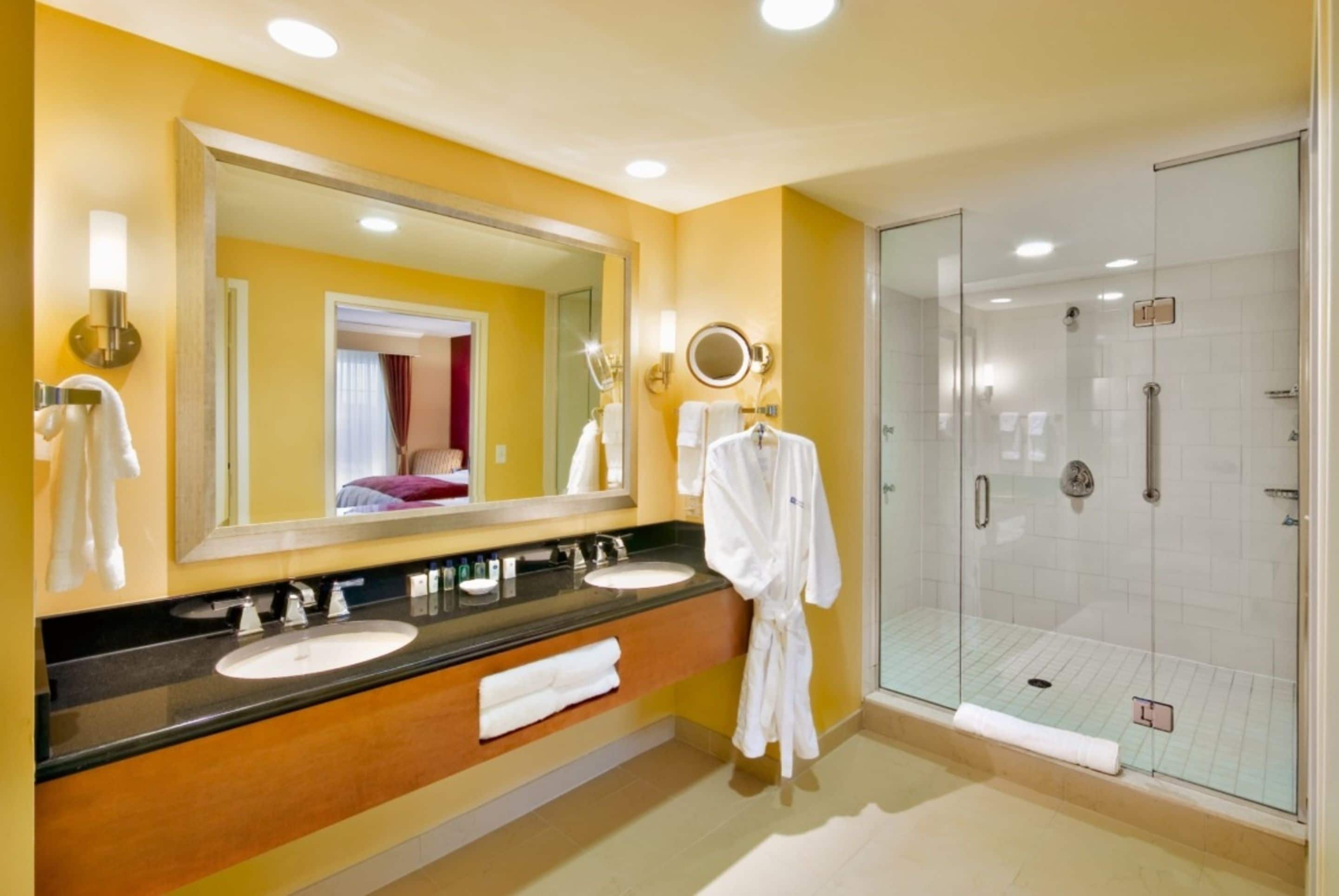 designer toiletries, hair dryer, towels, soap