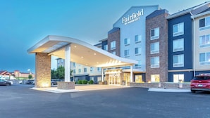 A Fairfield by Marriott hotel with a modern entrance, multiple floors, and a parking lot.