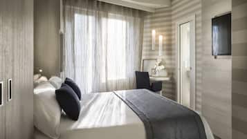 Ropa de cama de alta calidad, minibar, caja fuerte y escritorio