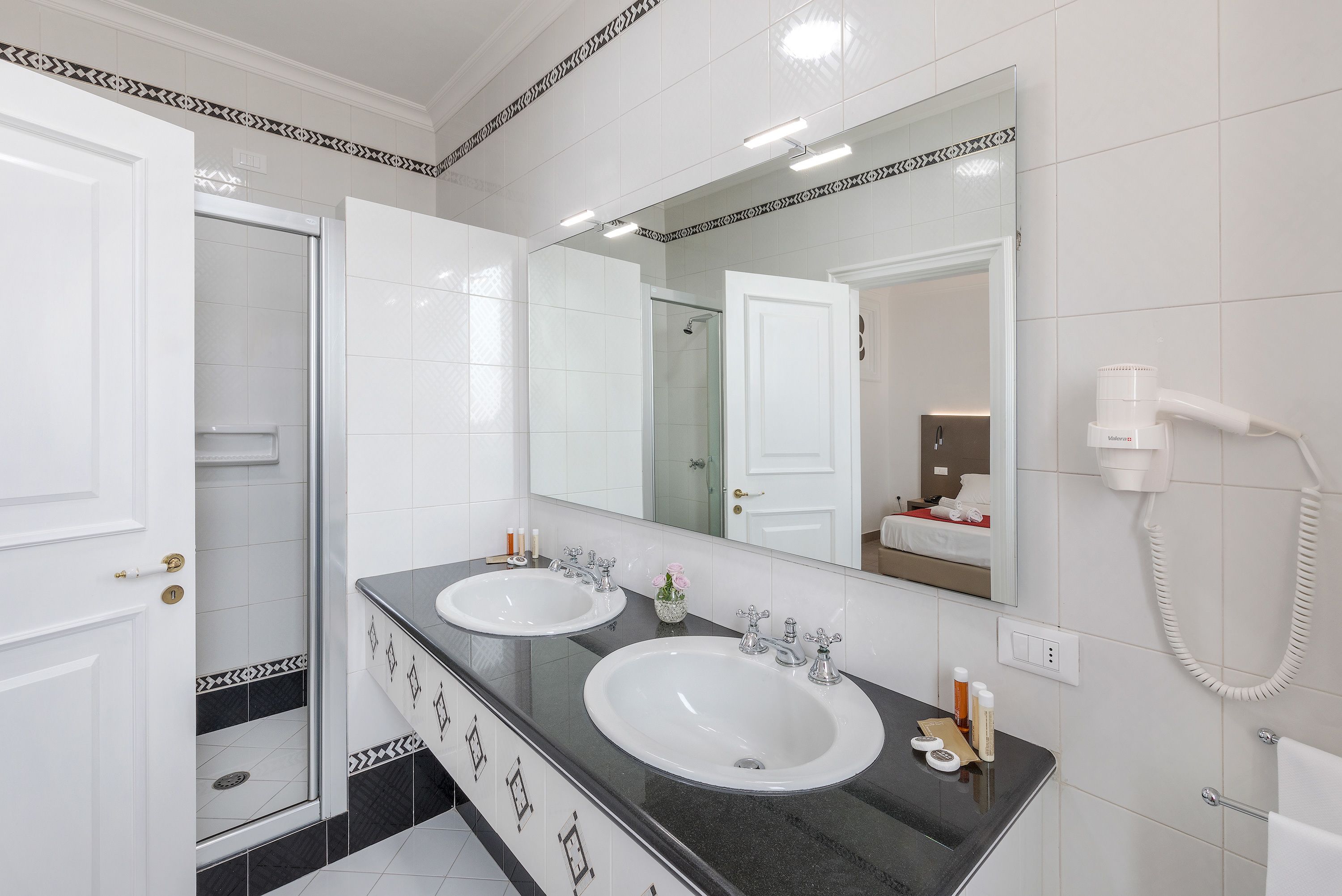 superior quadruple room | bathroom | shower, free toiletries, hair dryer, slippers