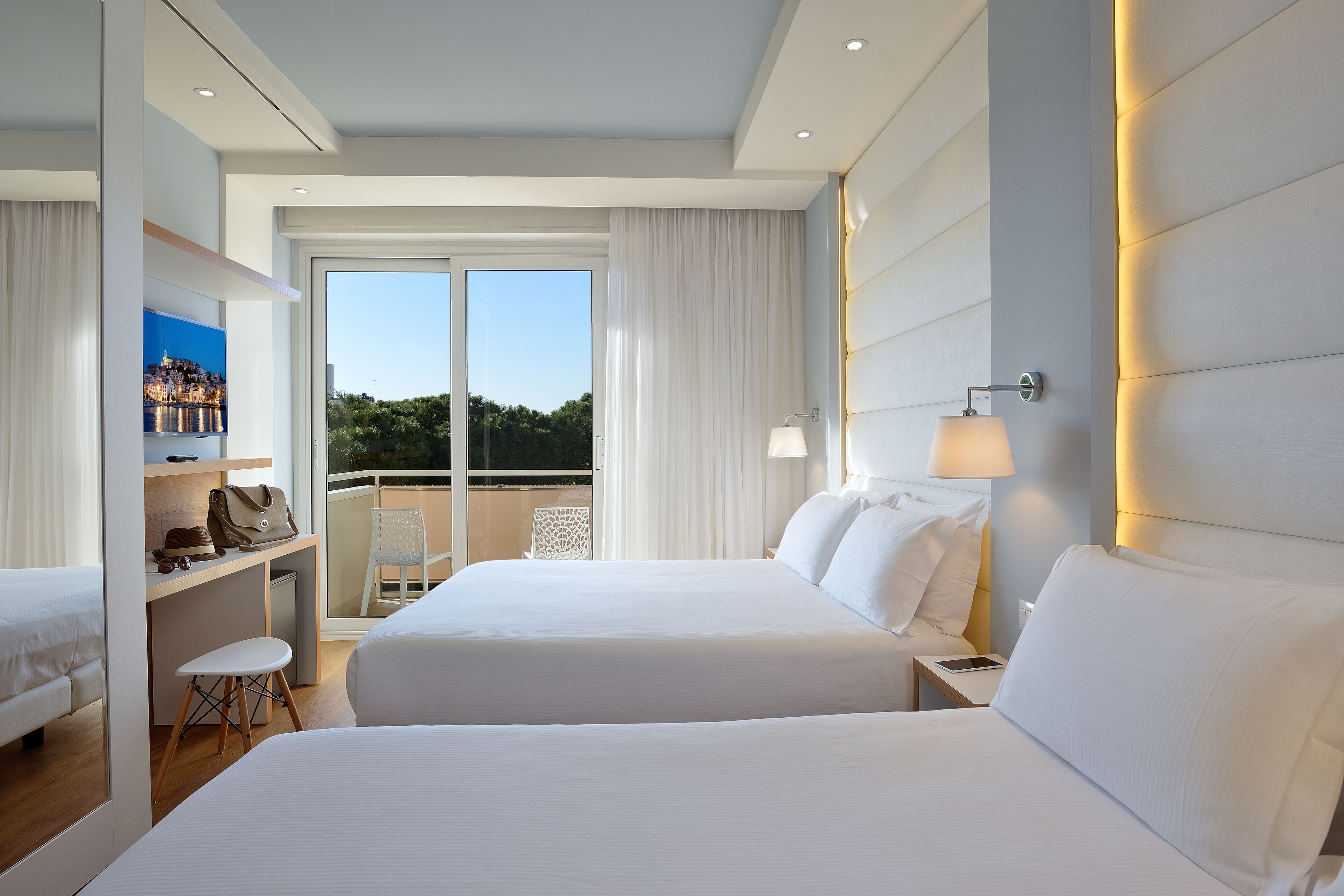 deluxe quadruple room, 1 bedroom, balcony, pool view | 1 bedroom, minibar, in-room safe, desk