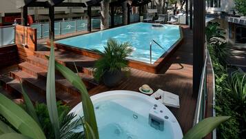 Seasonal outdoor pool, open 9:30 AM to 9:30 PM, pool loungers