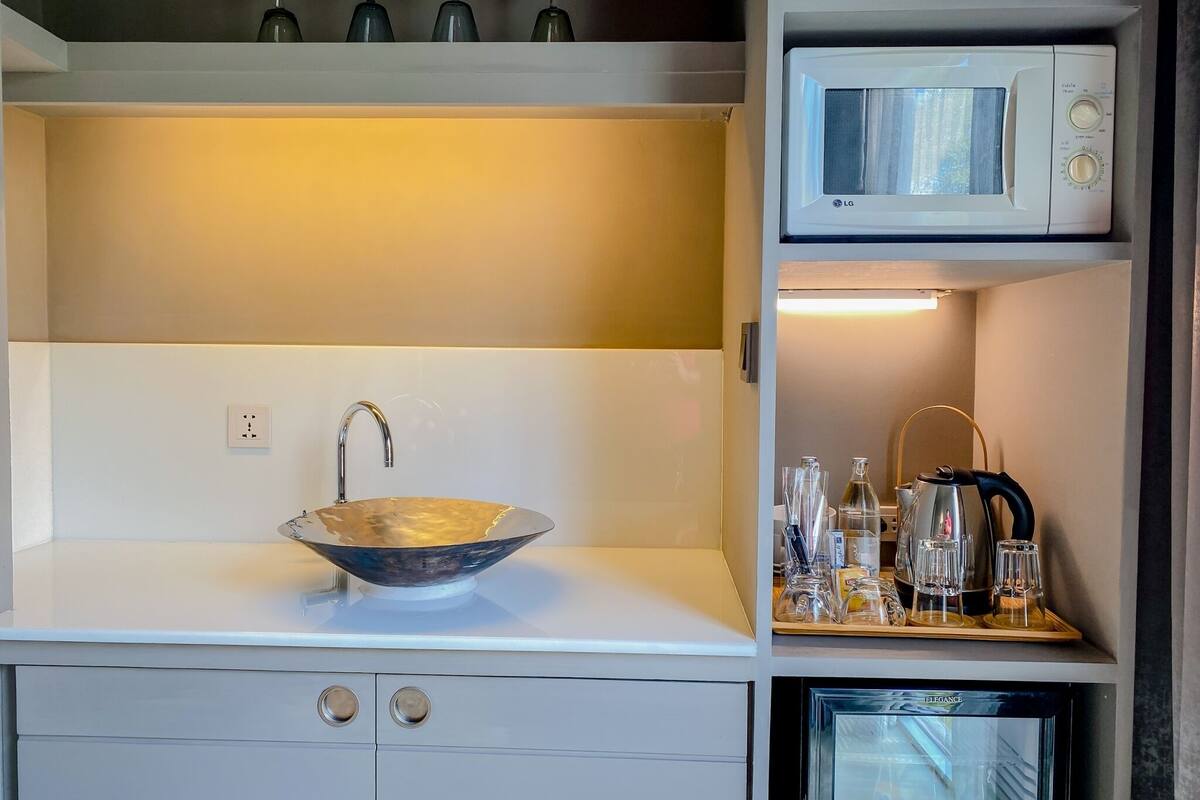 executive quadruple  | bathroom | shower, rainfall showerhead, designer toiletries, hair dryer