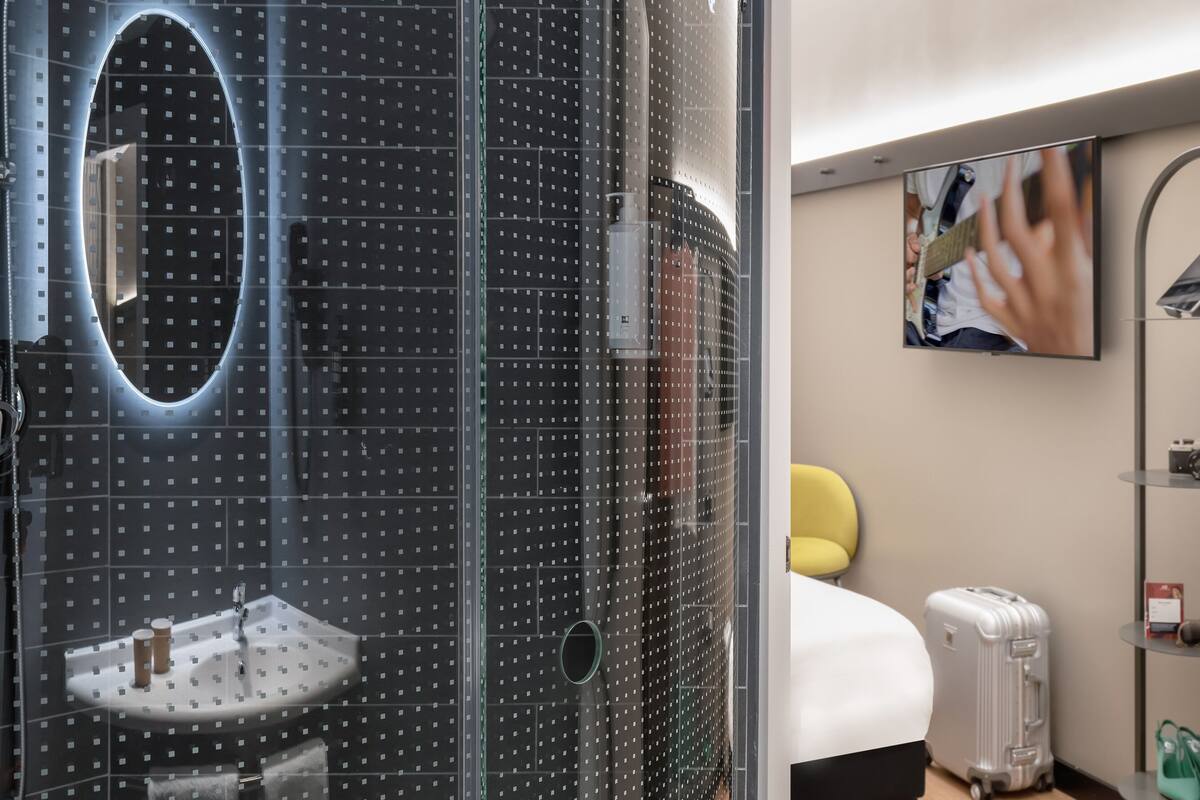 shower, eco-friendly toiletries, hair dryer, towels