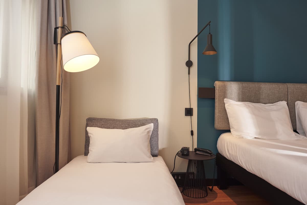 room, multiple beds | down duvets, in-room safe, desk, laptop workspace