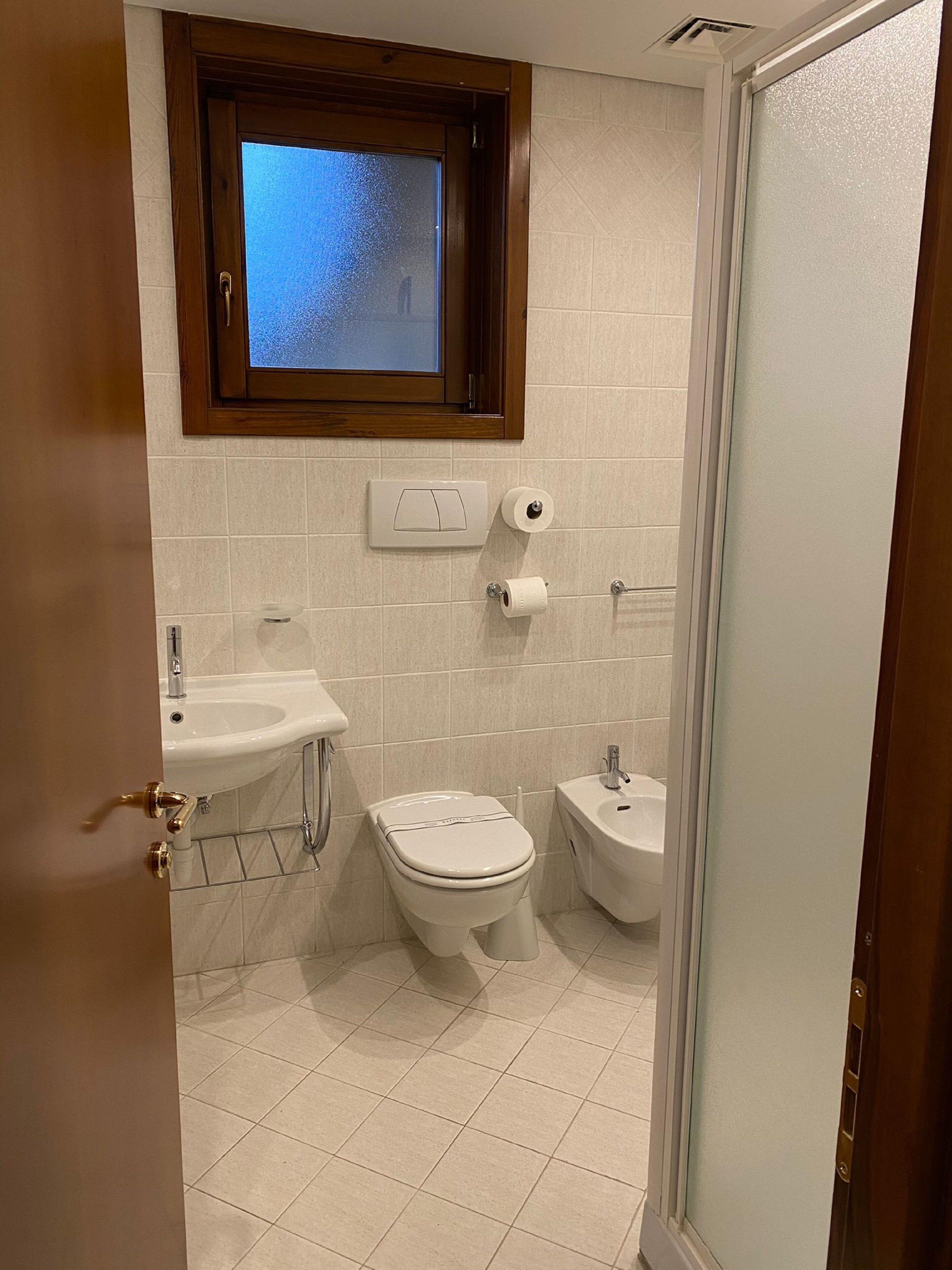 shower, hair dryer, slippers, bidet