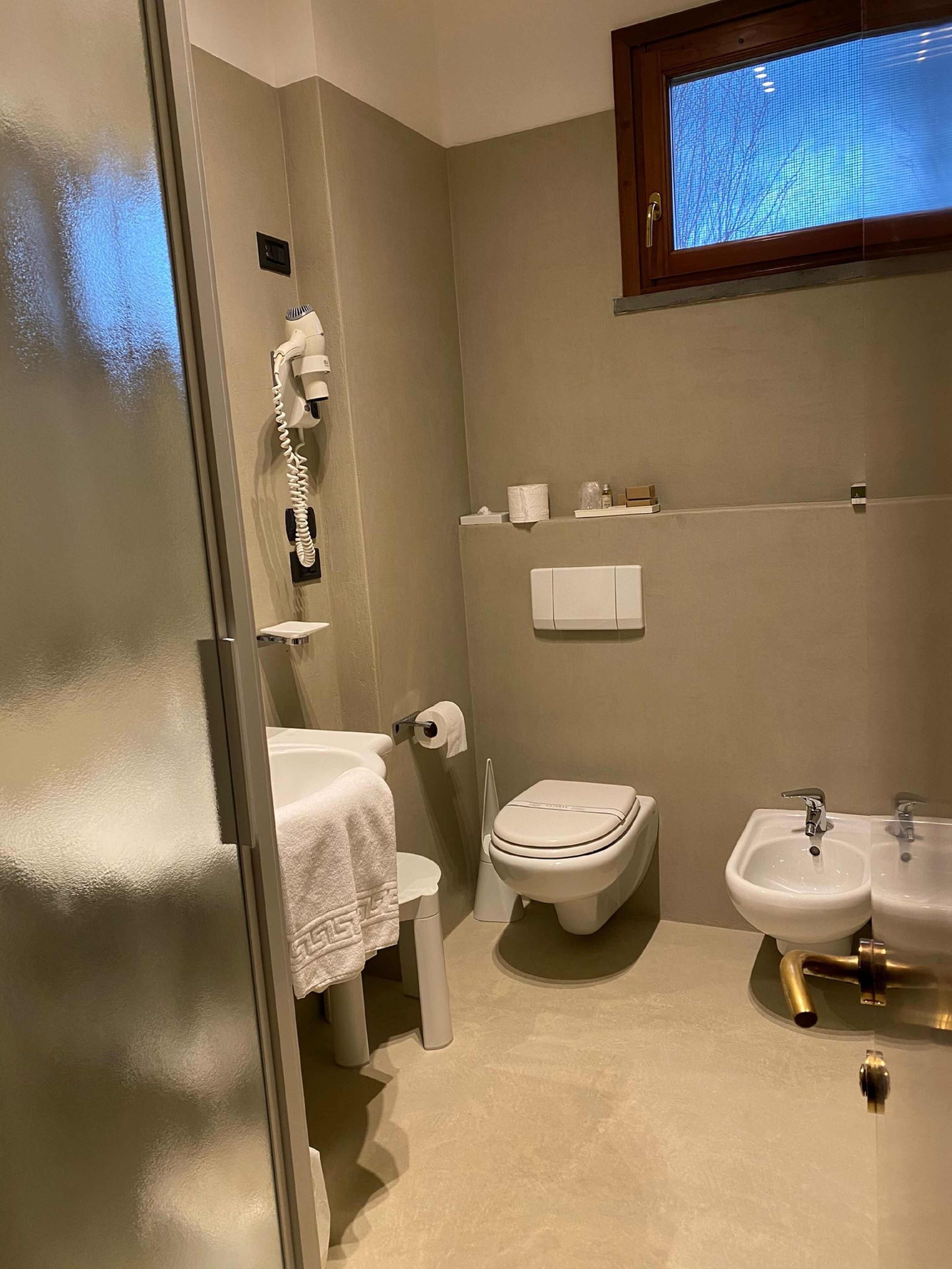 shower, hair dryer, slippers, bidet