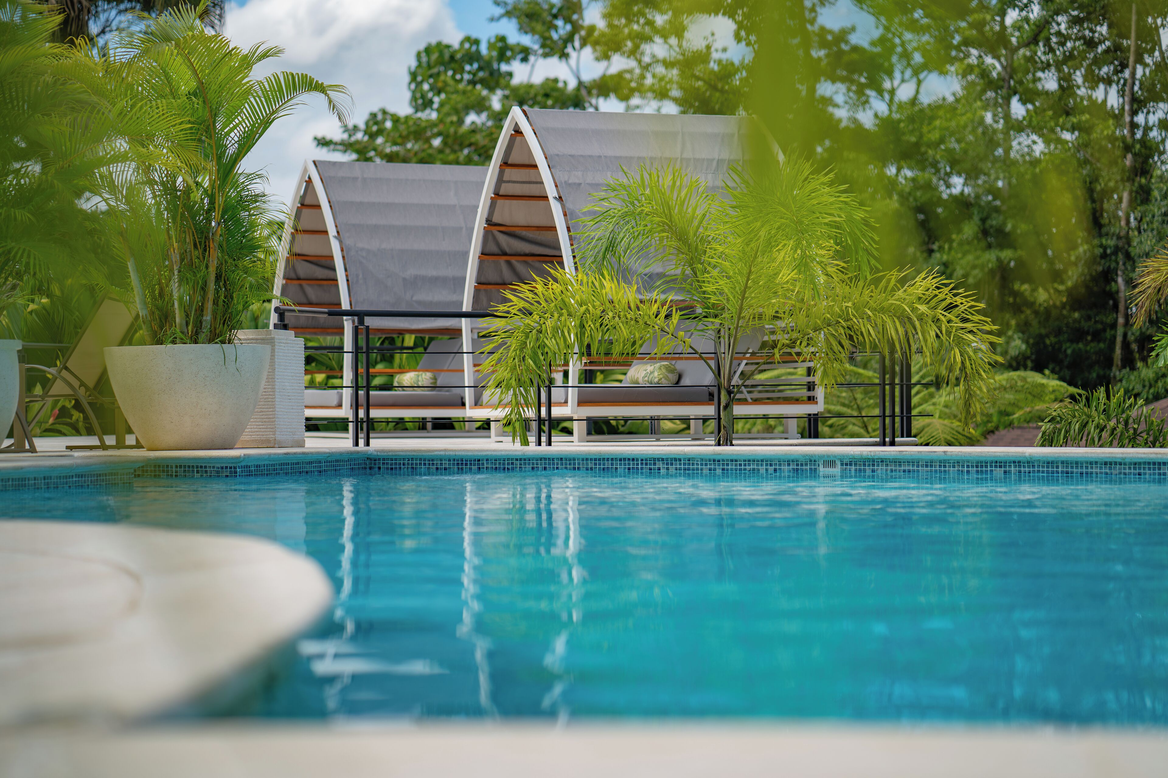 2 outdoor pools, open 9:30 AM to 10:00 PM, free cabanas, pool umbrellas