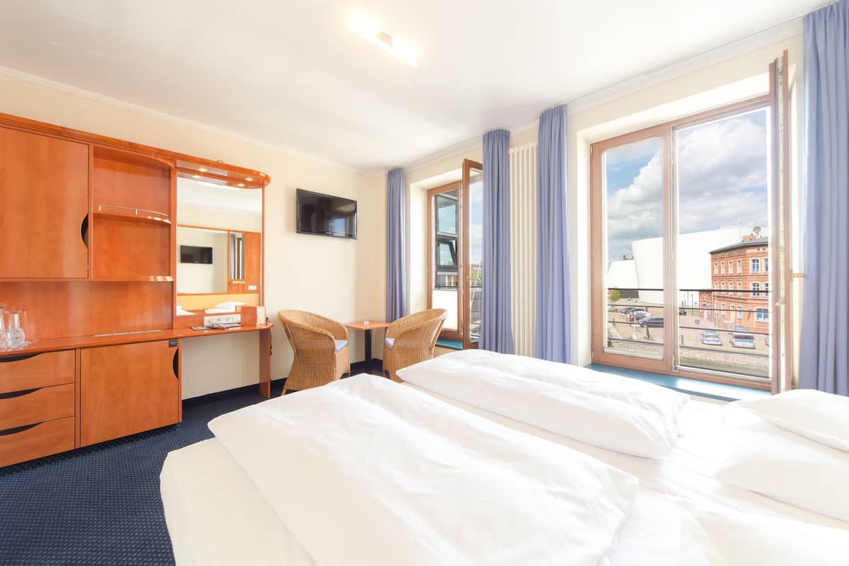 standard double room | living area | 32-inch flat-screen tv with satellite channels, tv