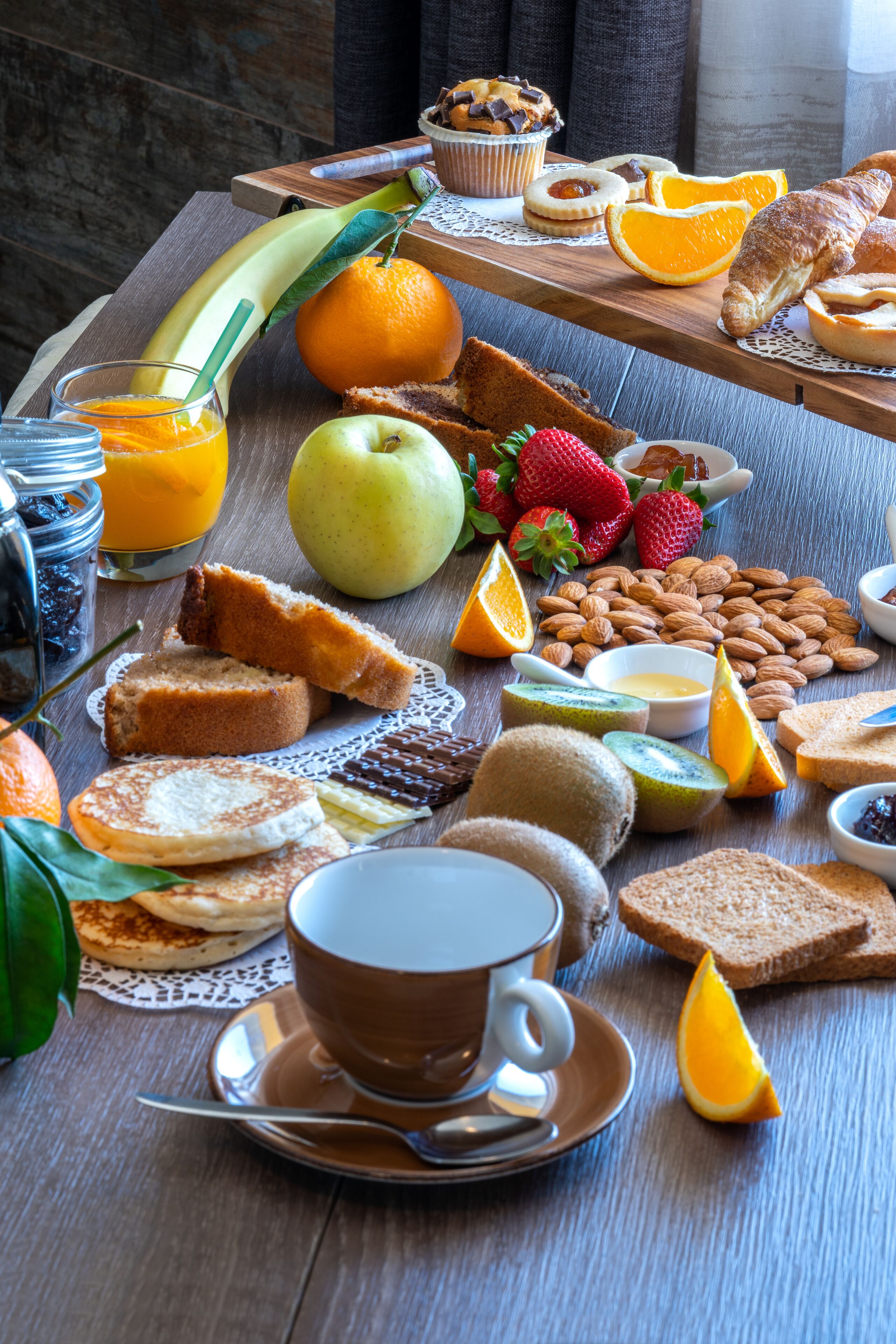 A breakfast buffet with various foods and beverages.