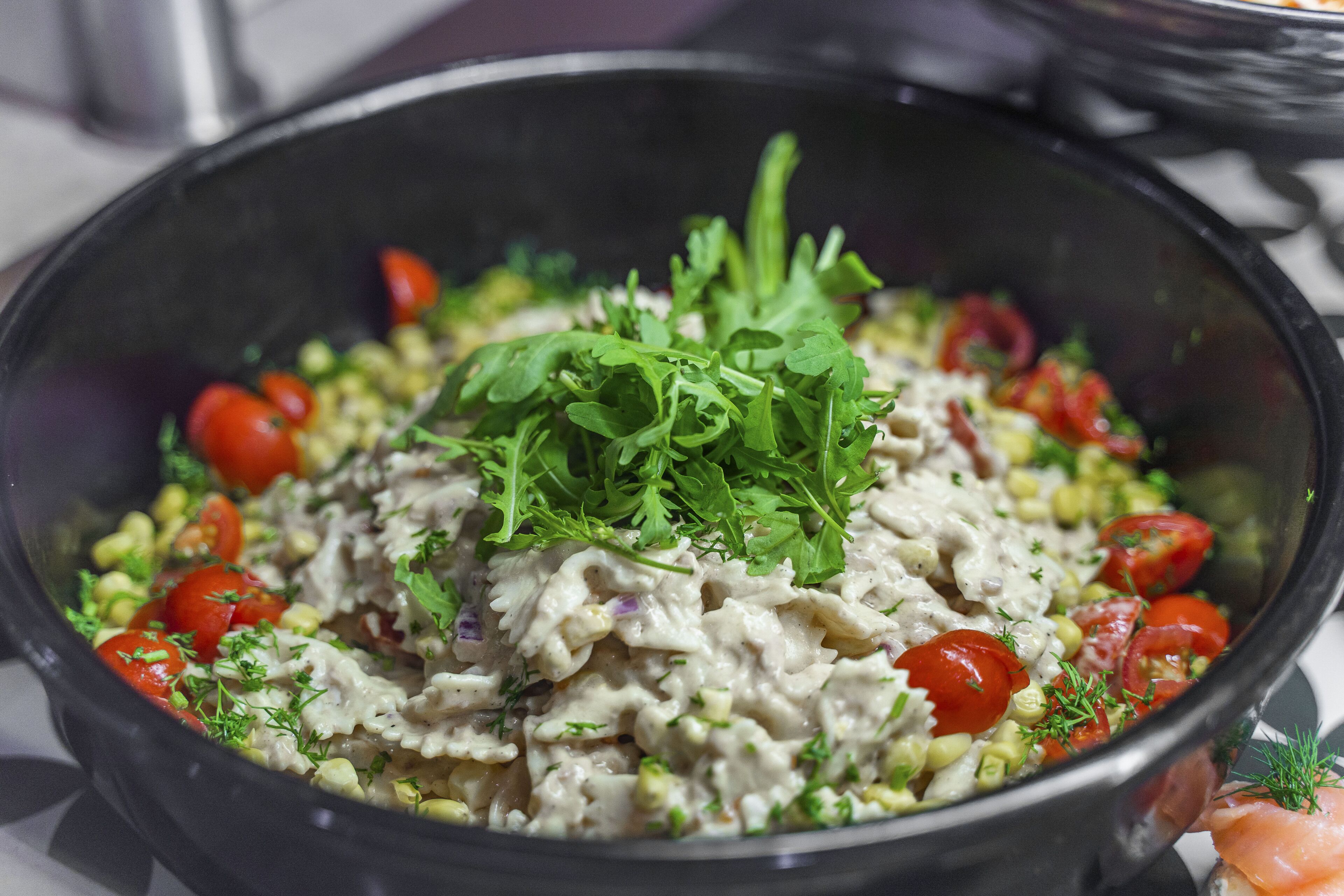 A bowl of salad with various ingredients.