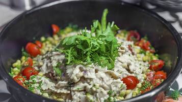 A bowl of salad with various ingredients.
