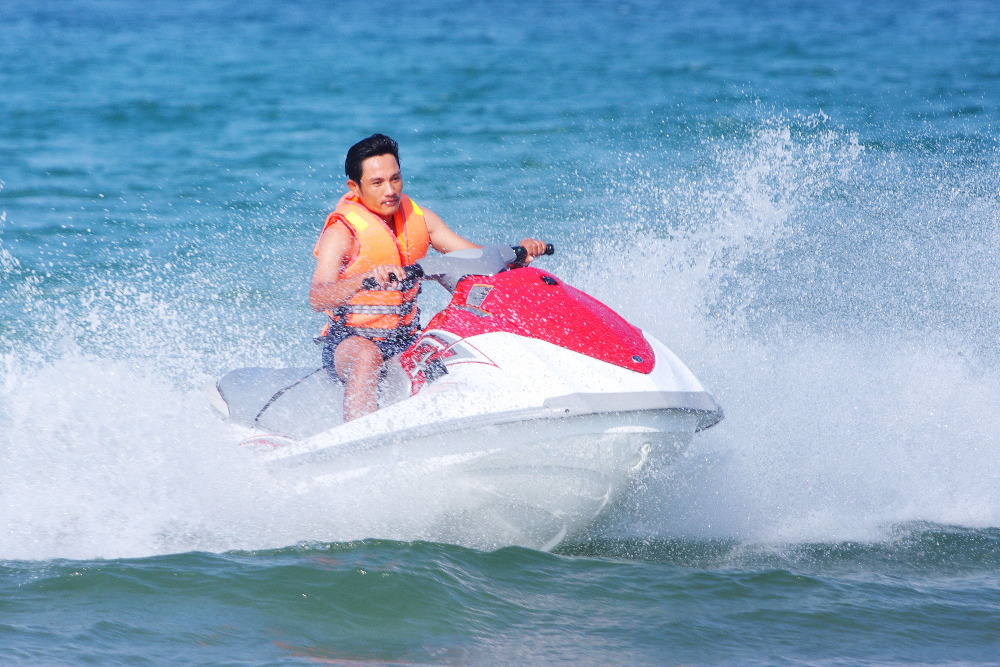 A person riding a jet ski on water.