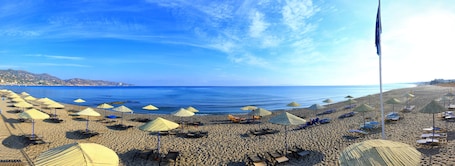Private beach, sun loungers, beach umbrellas, beach towels. Apollonia Beach Resort & Spa