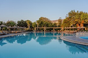 Seasonal outdoor pool, open 9:00 AM to 6:00 PM, pool umbrellas