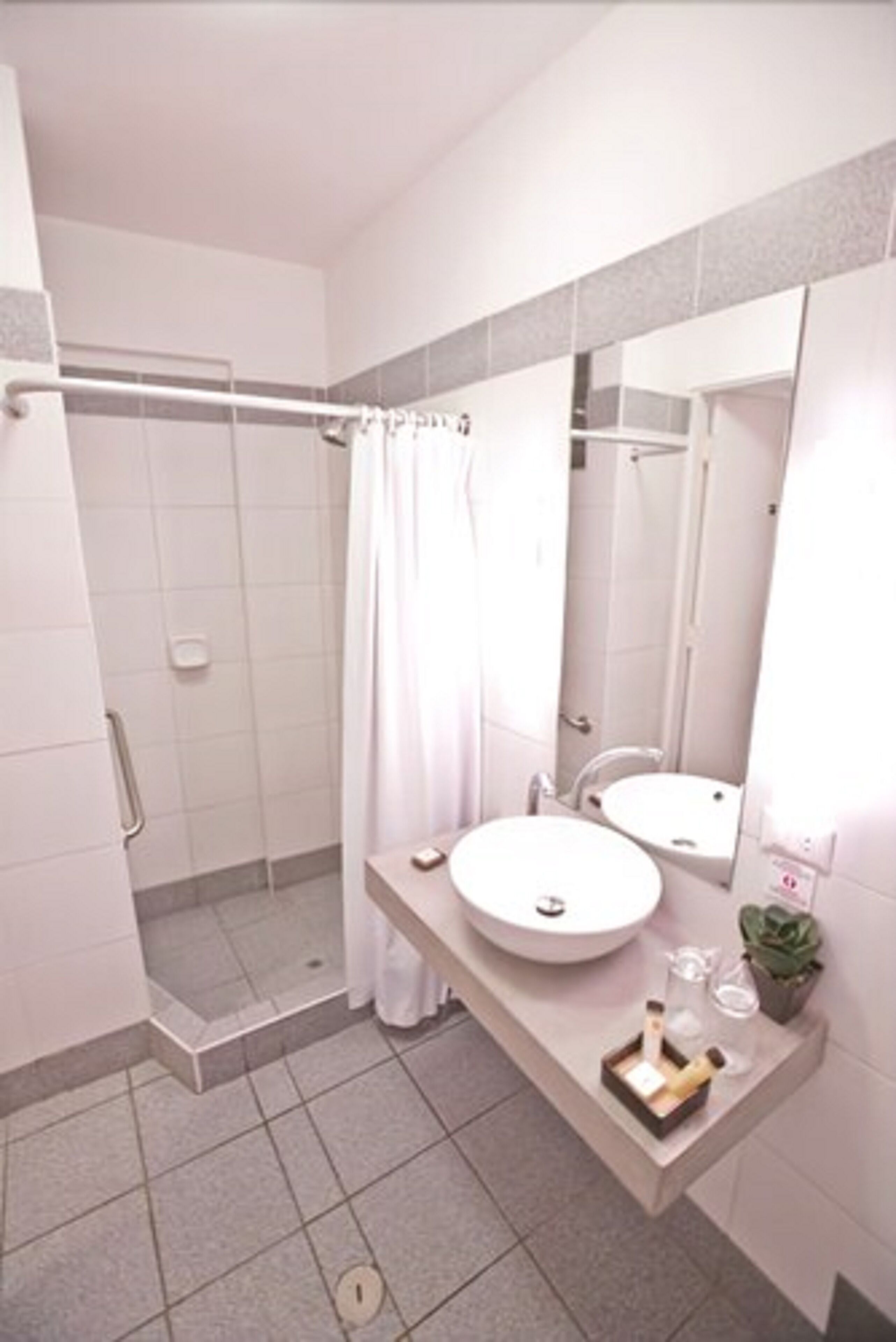 standard double room, 1 king bed | bathroom | shower, free toiletries, hair dryer, towels