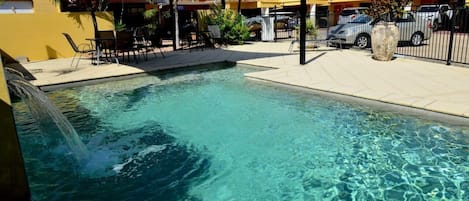 Outdoor pool, pool umbrellas, sun loungers