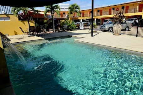 Outdoor pool, pool umbrellas, sun loungers