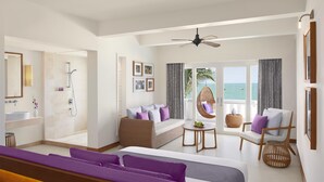 A modern hotel room with a balcony, a sofa, a bed, and a bathroom with a shower. - Avani Quy Nhon Resort (Quy Nhon Nam)