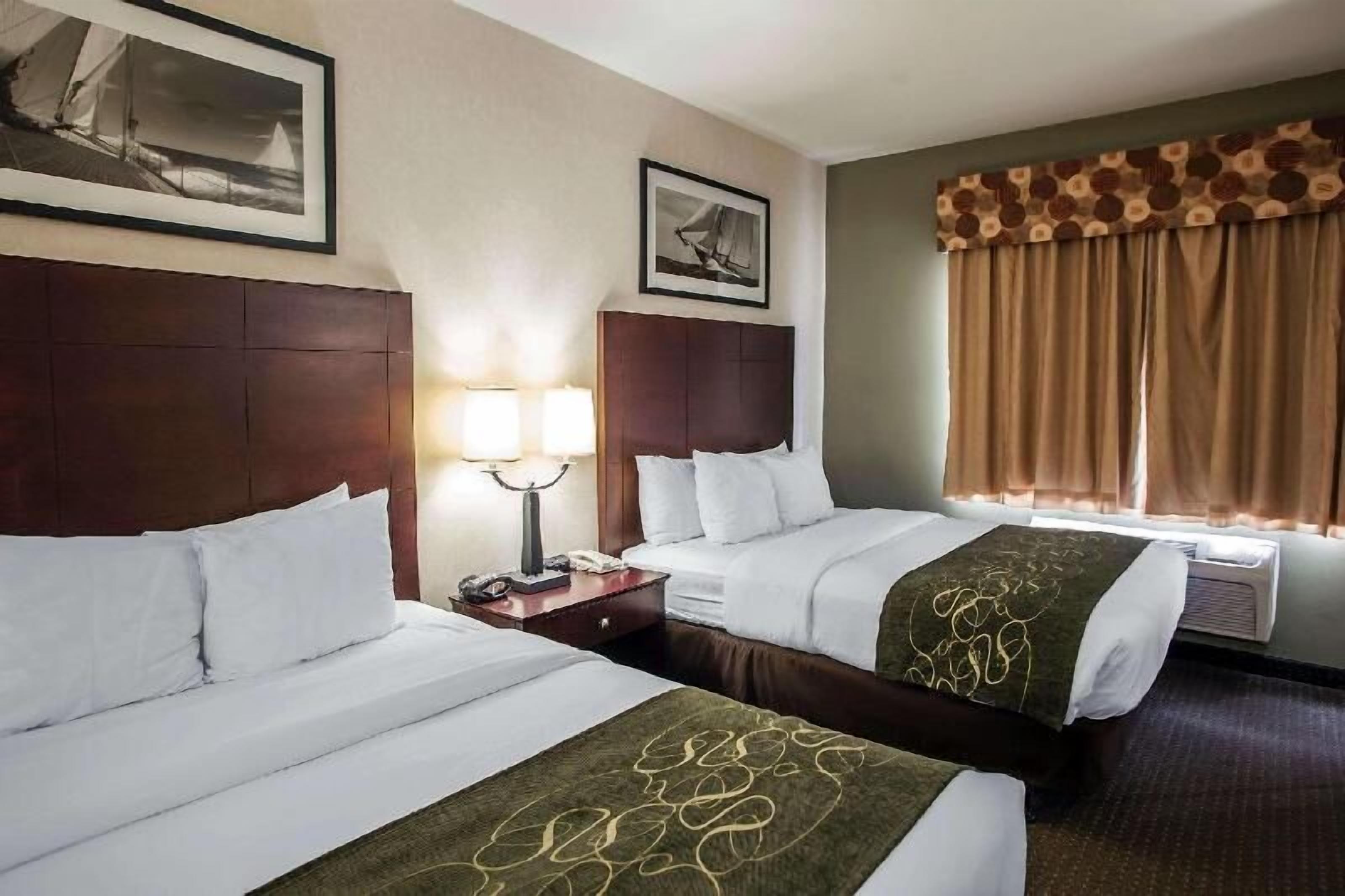 Pillowtop beds, desk, blackout drapes, iron/ironing board