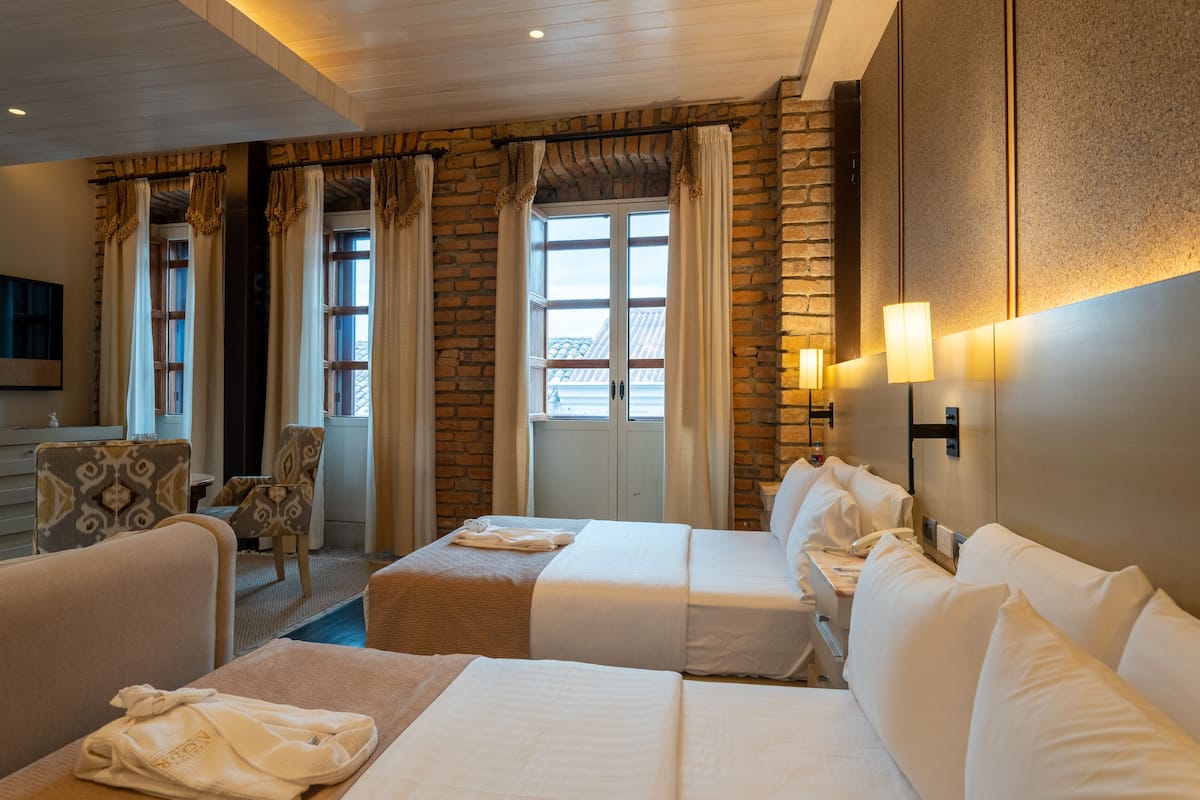 exclusive suite, multiple beds, kitchen, executive level | 1 bedroom, premium bedding, in-room safe, individually decorated