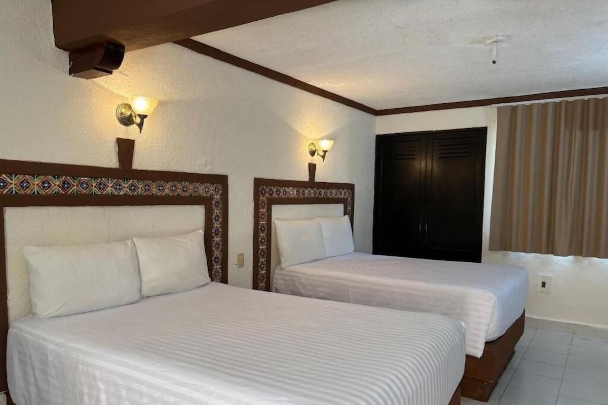 Down comforters, desk, blackout drapes, WiFi (free)