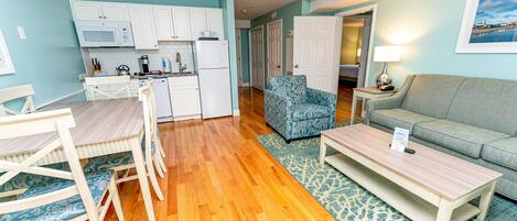 A compact living space with a kitchen, dining area, and seating area.