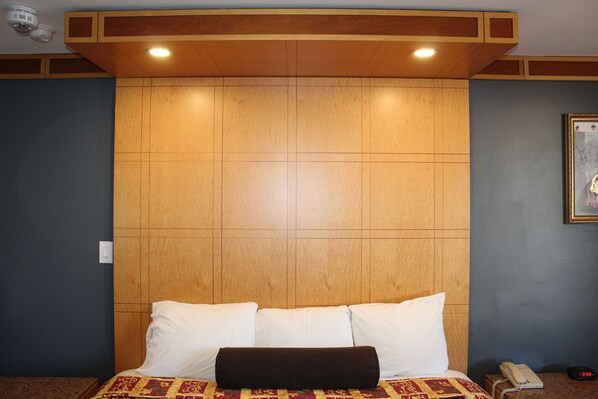 Premium bedding, desk, laptop workspace, blackout drapes