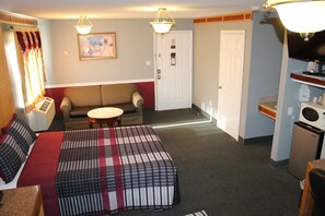 Premium bedding, desk, laptop workspace, blackout drapes