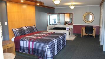 Premium bedding, desk, laptop workspace, blackout drapes