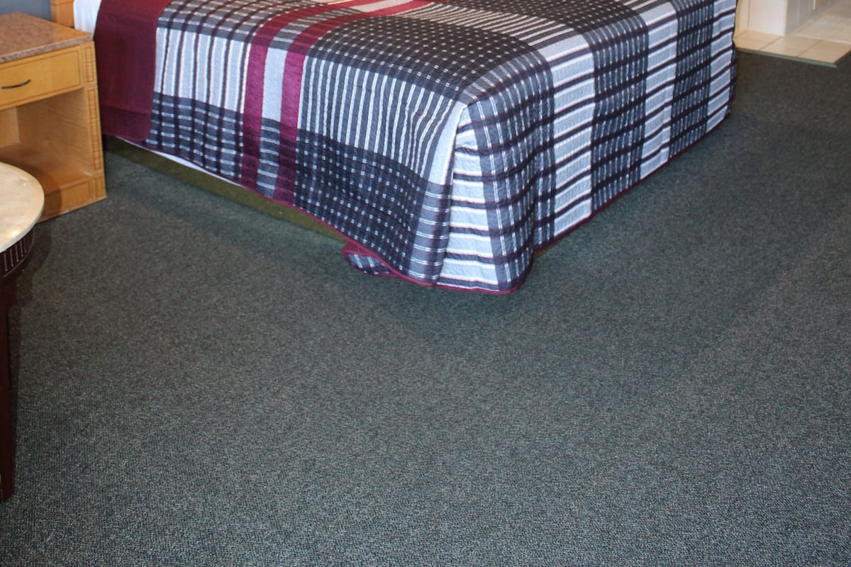 Premium bedding, desk, laptop workspace, blackout curtains