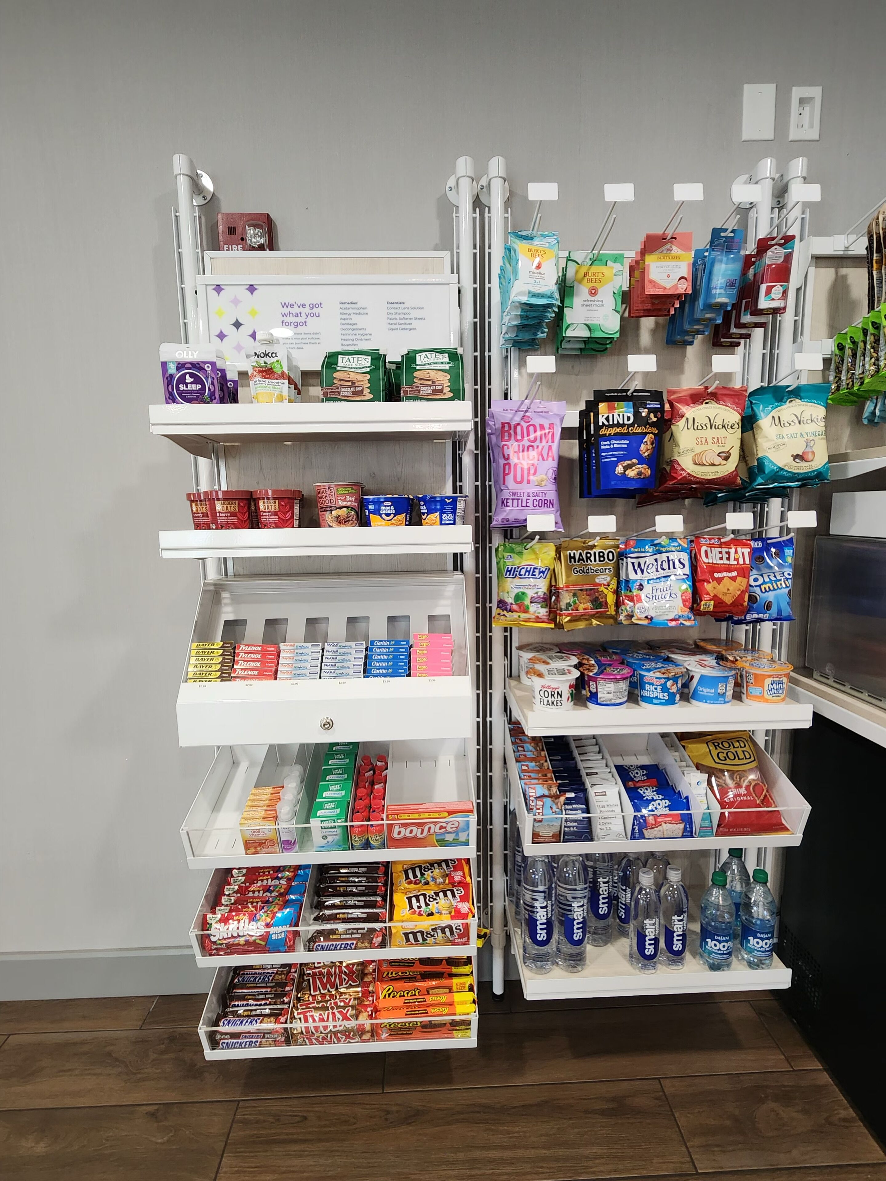 A snack and beverage display in a store with various brands and products.