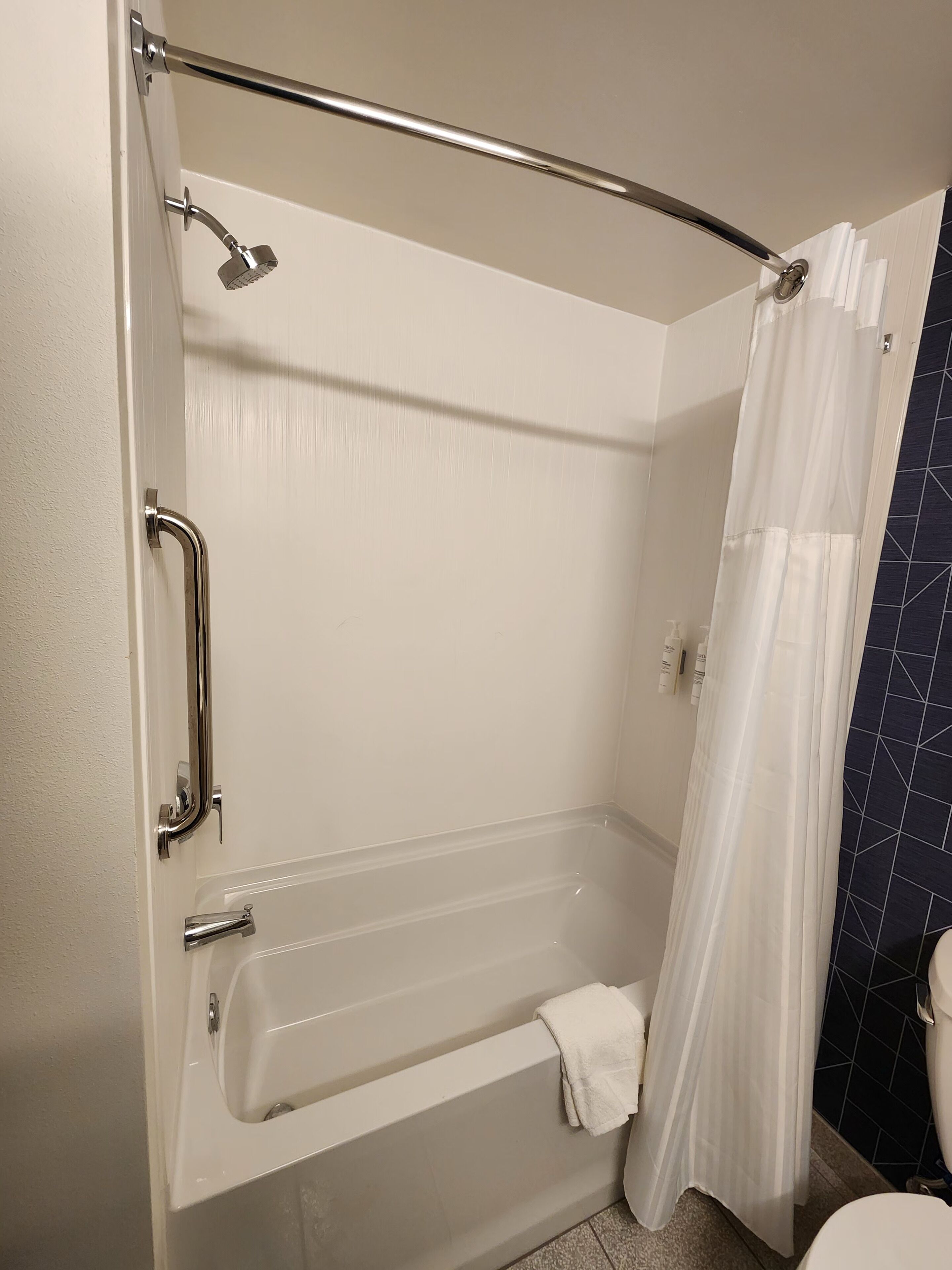 A bathroom with a bathtub, a shower, and a toilet.
