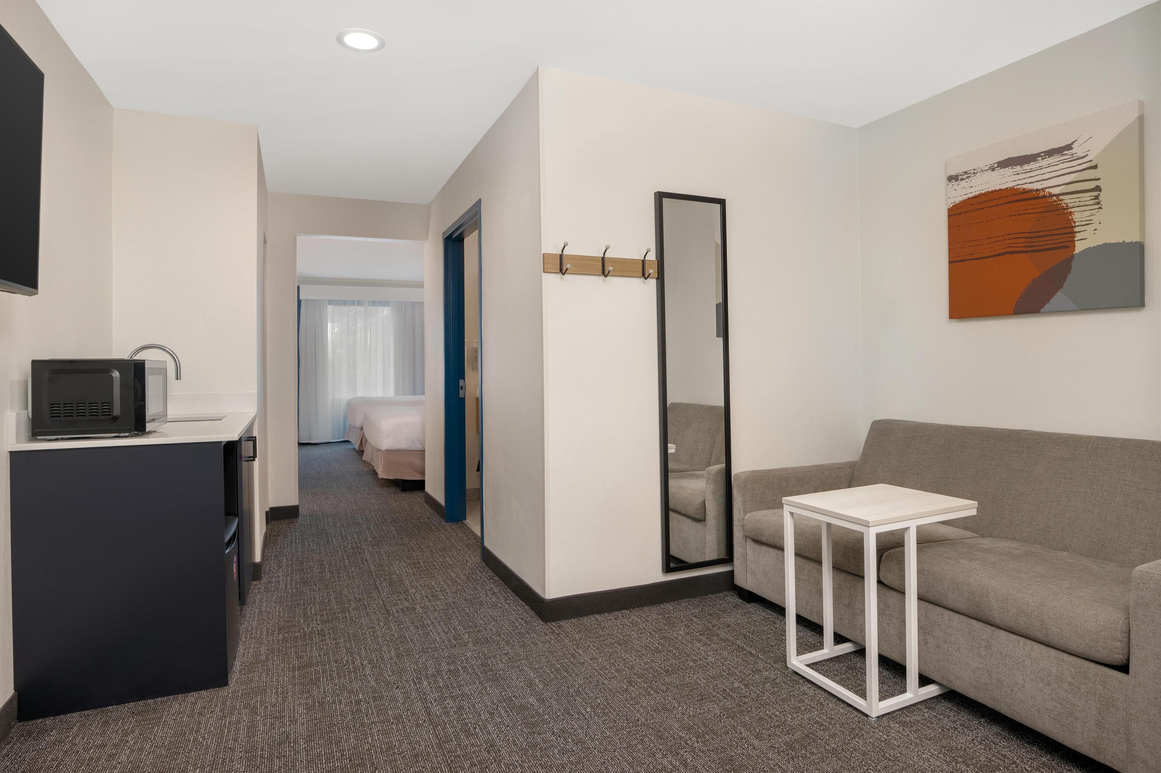 Suite, 1 King Bed, Accessible, Bathtub (Mobility) | Living area | 42-inch TV with cable channels