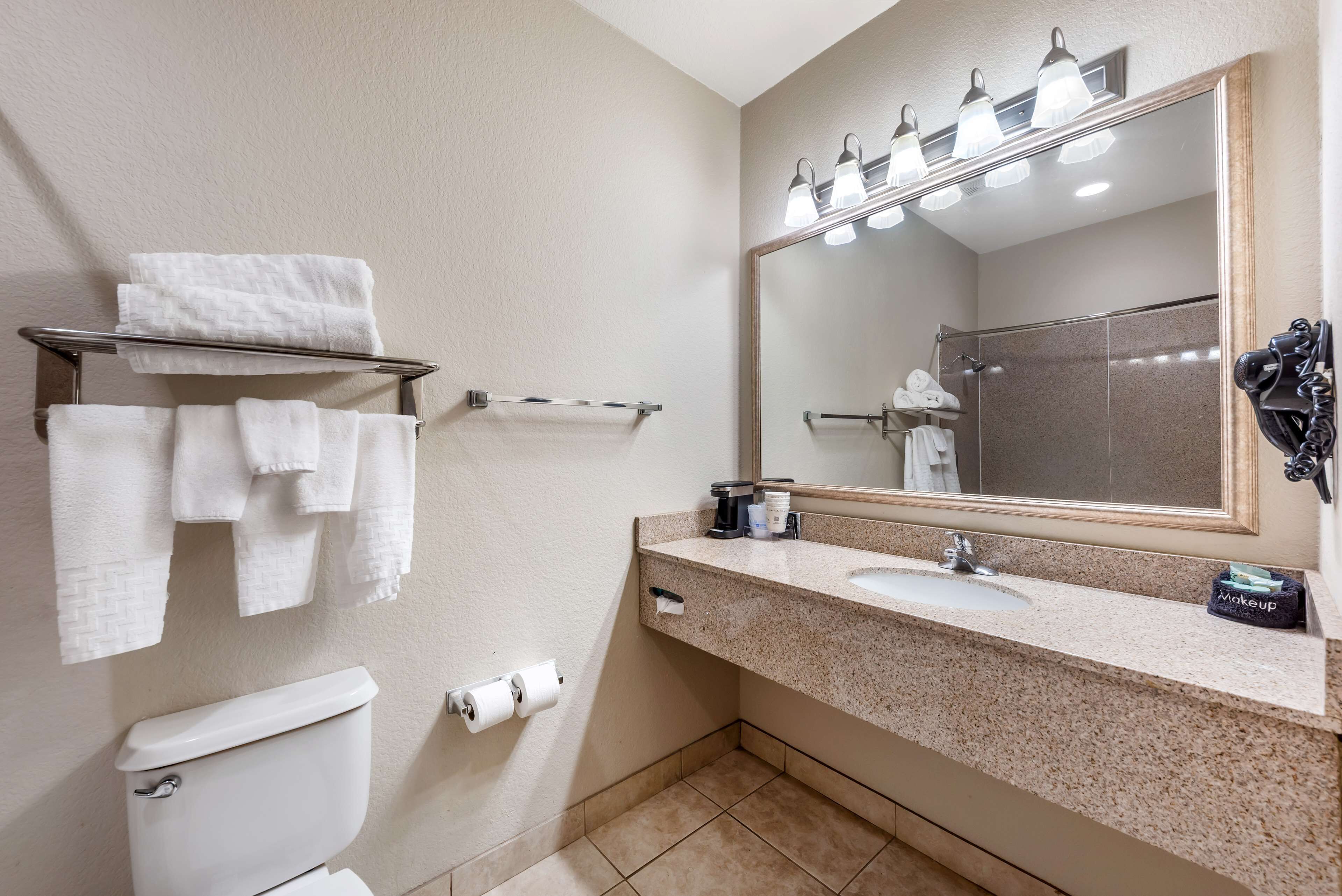 suite, 1 king bed, non smoking, microwave | bathroom | combined shower/bathtub, free toiletries, hair dryer, towels