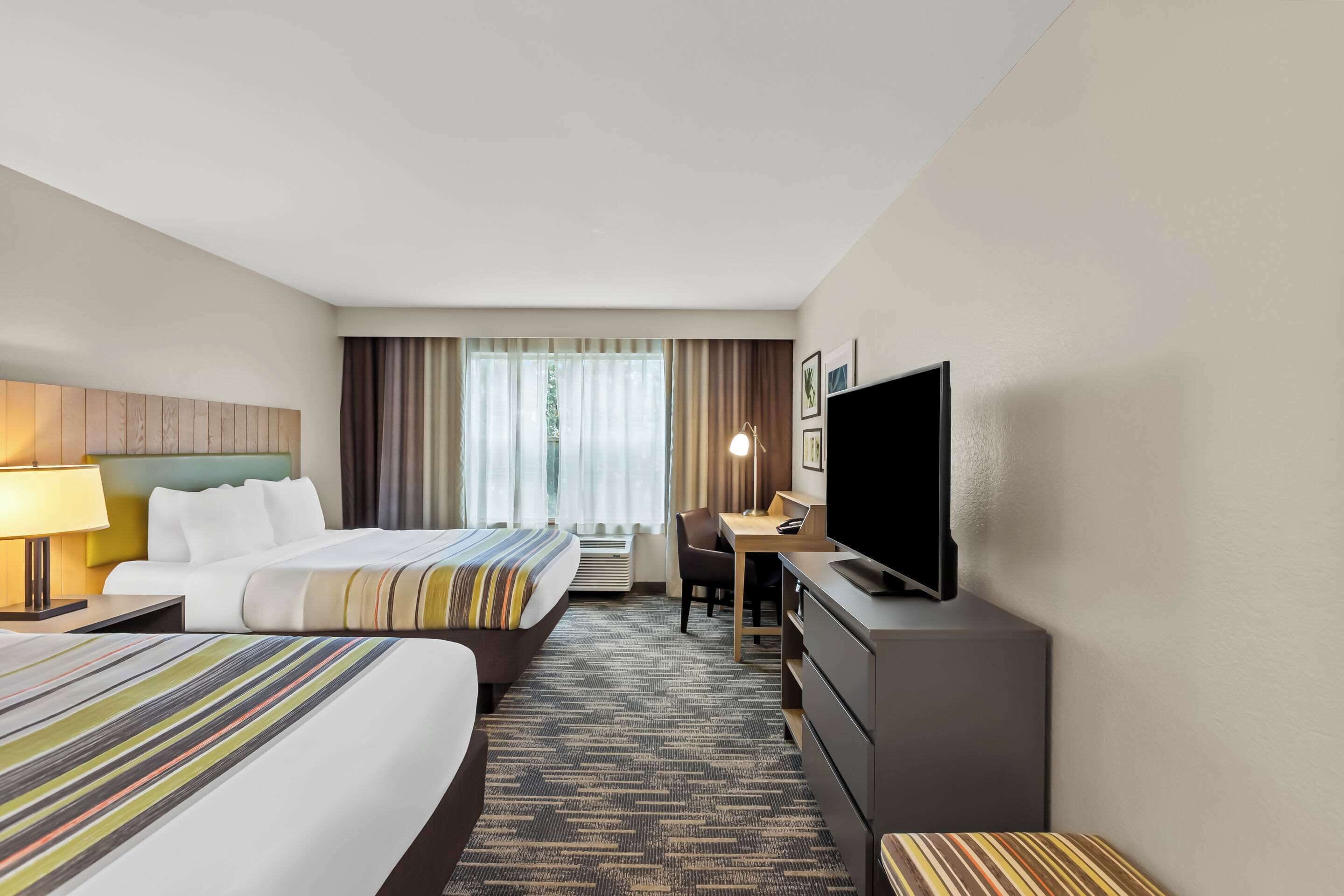 tempur-pedic beds, desk, blackout curtains, iron/ironing board