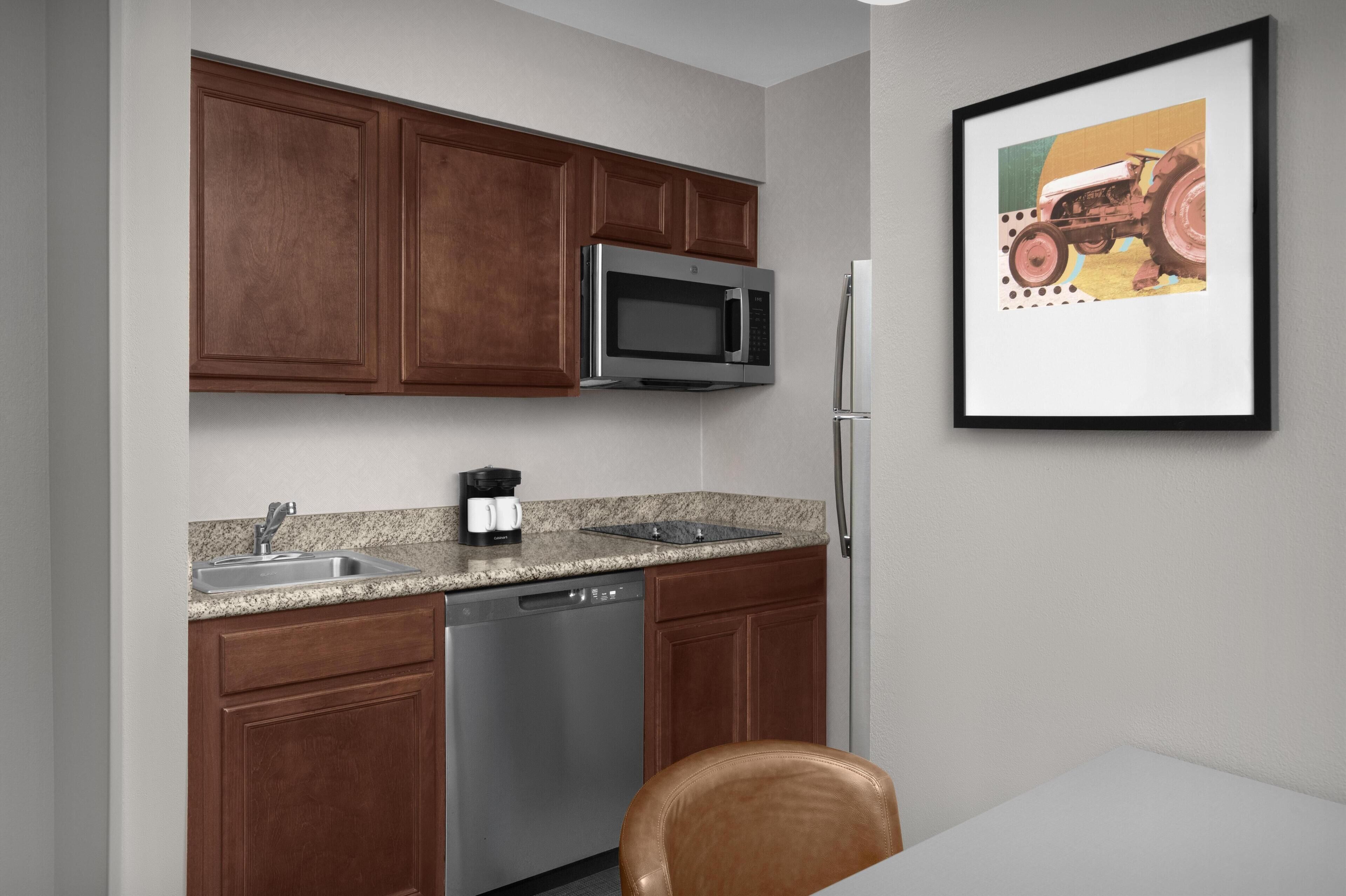Full-size fridge, microwave, stovetop, dishwasher