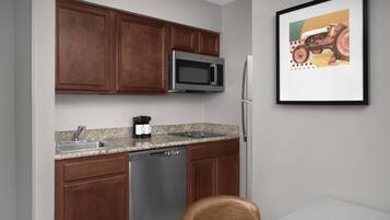 Full-size fridge, microwave, stovetop, dishwasher