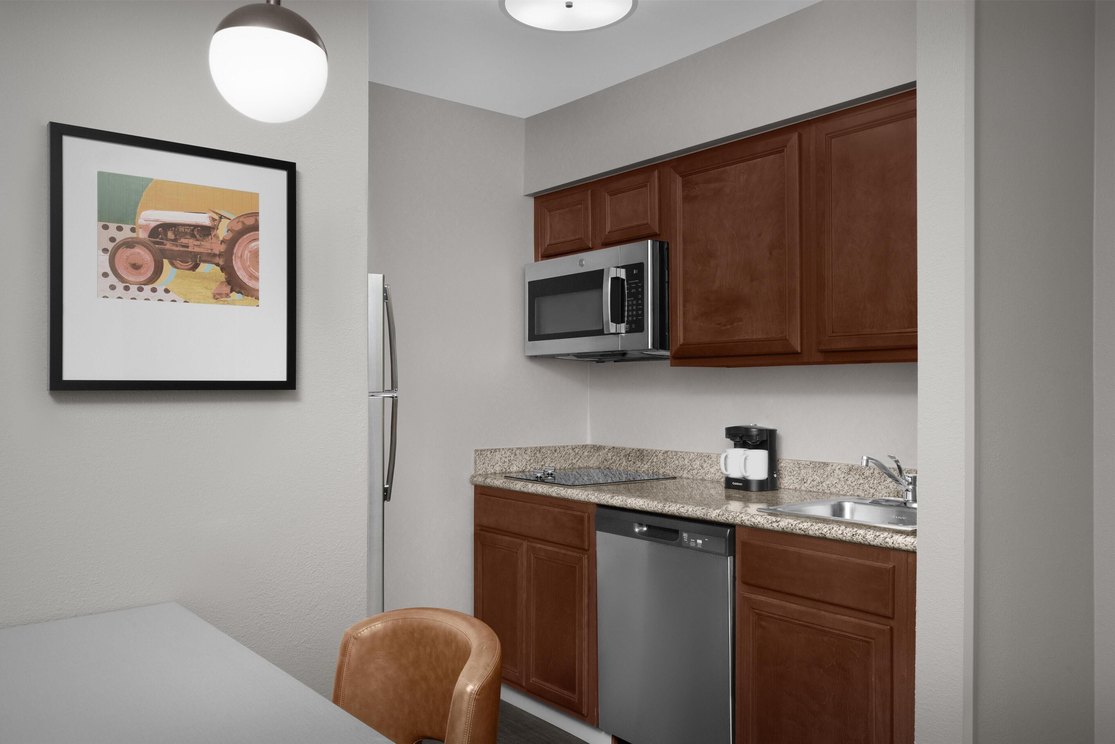 Full-size fridge, microwave, stovetop, dishwasher