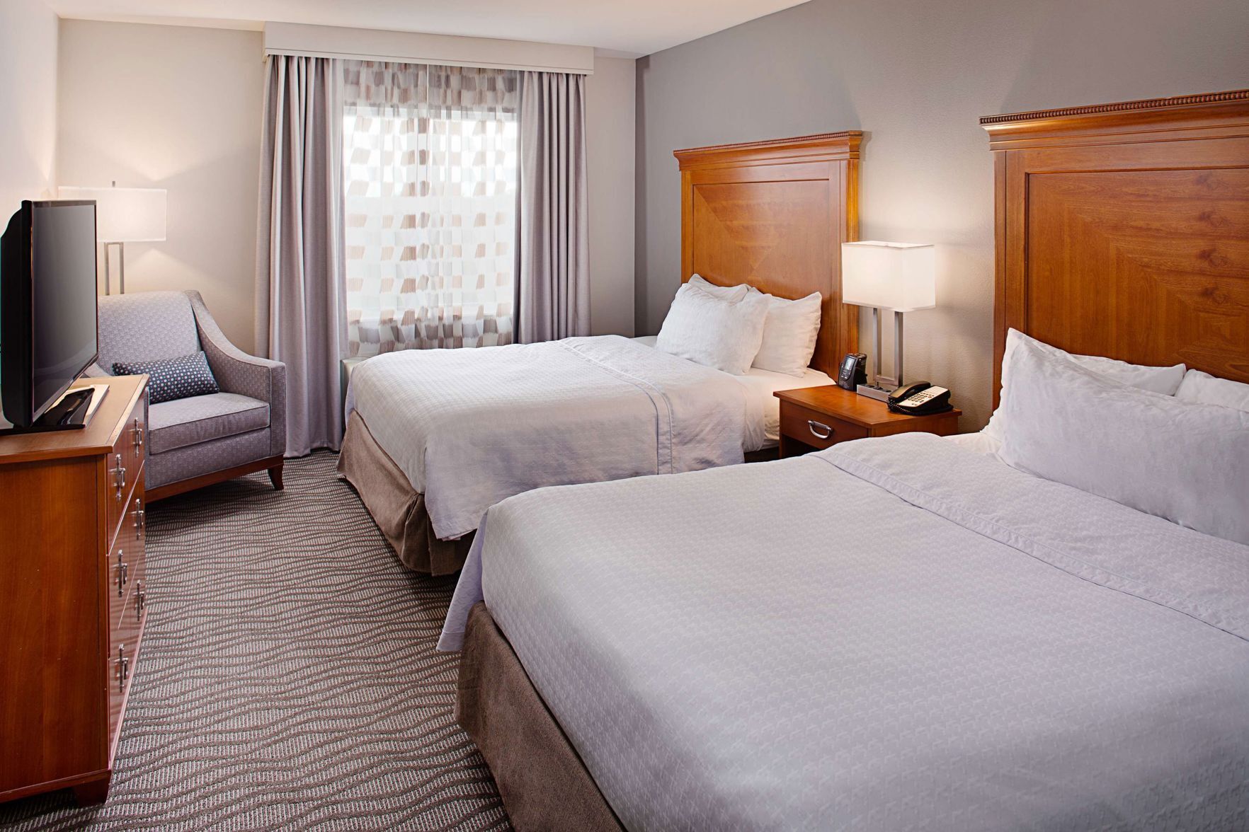Down duvets, pillow-top beds, in-room safe, desk