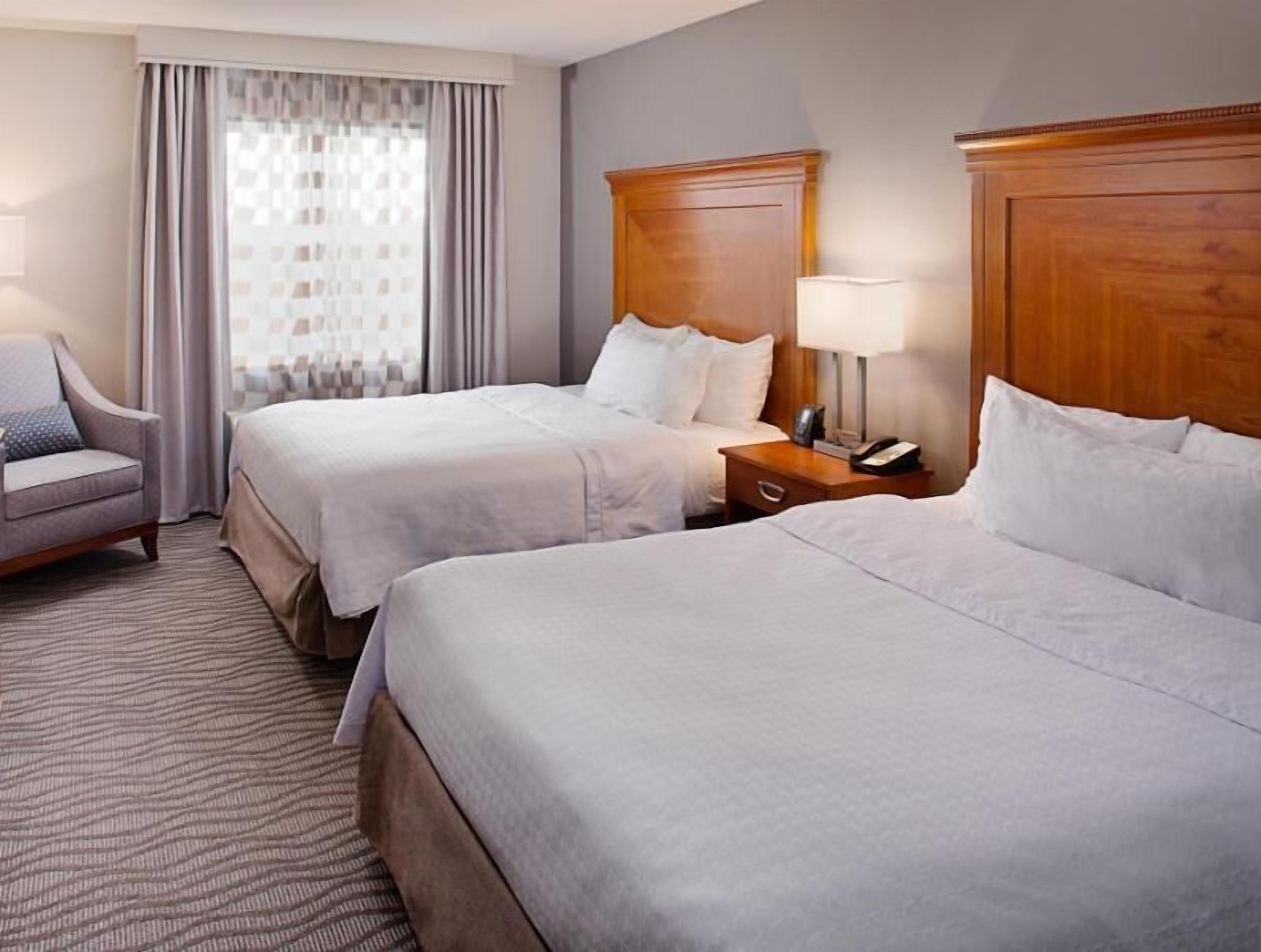 Down duvets, pillow-top beds, in-room safe, desk