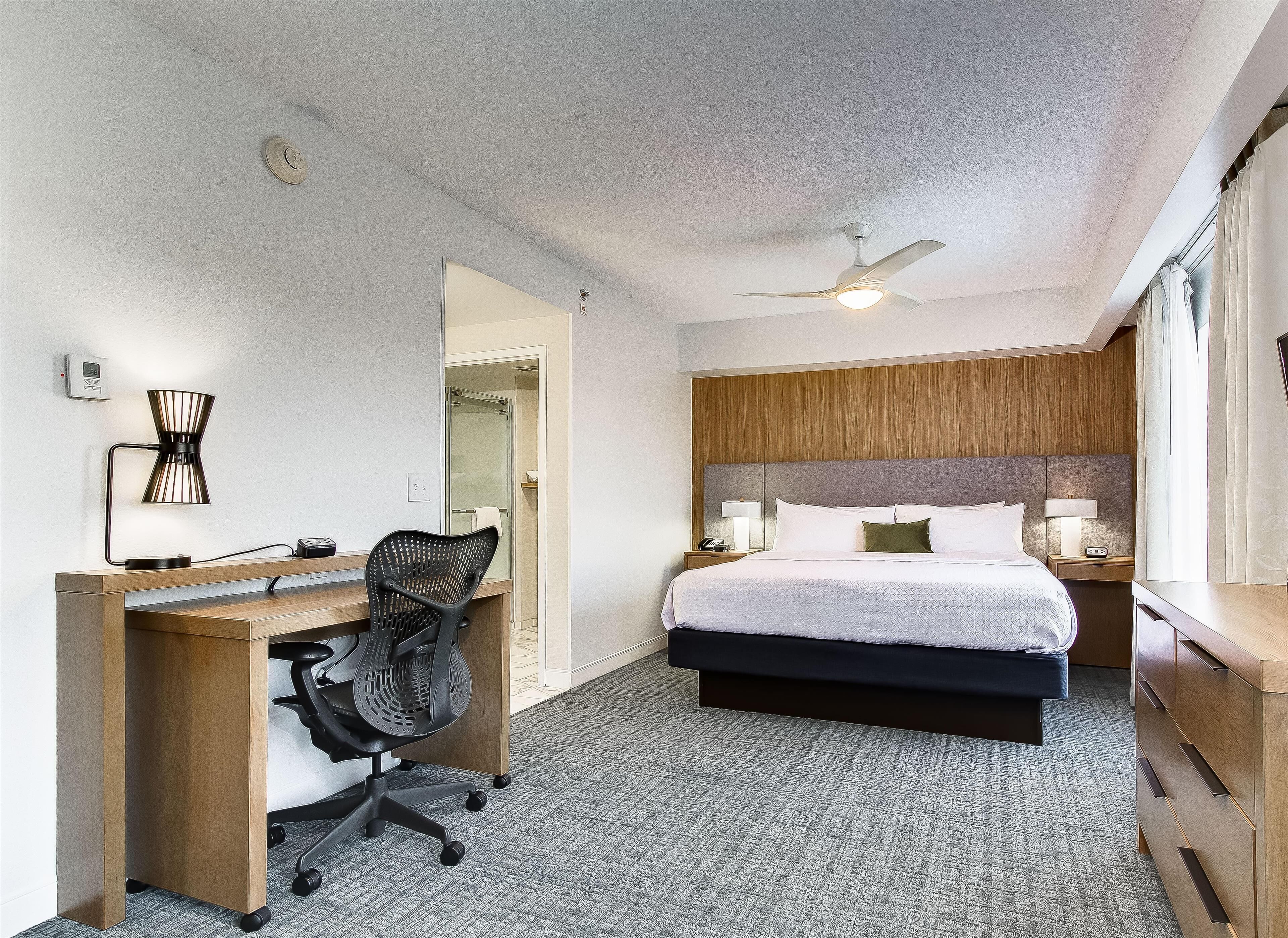 Premium bedding, pillow-top beds, desk, laptop workspace
