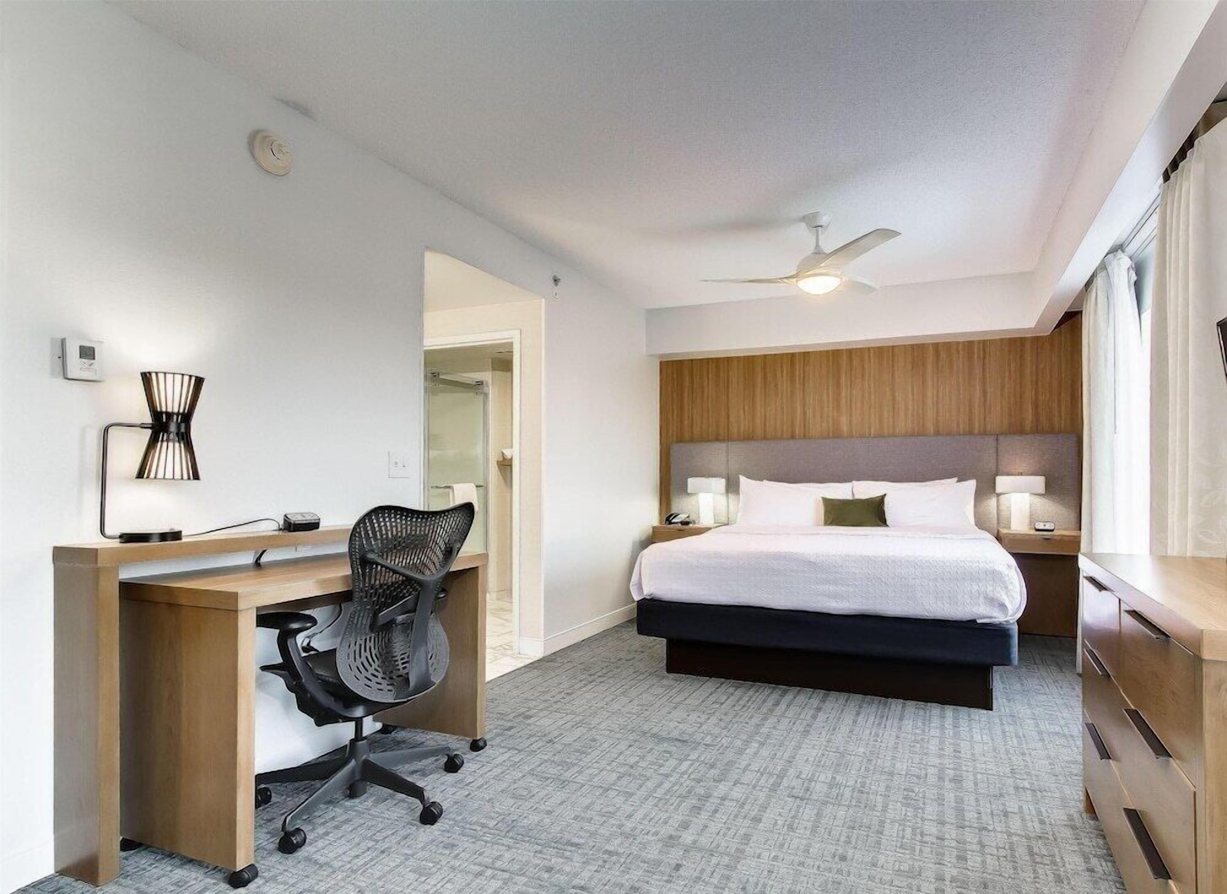 Premium bedding, pillow-top beds, desk, laptop workspace