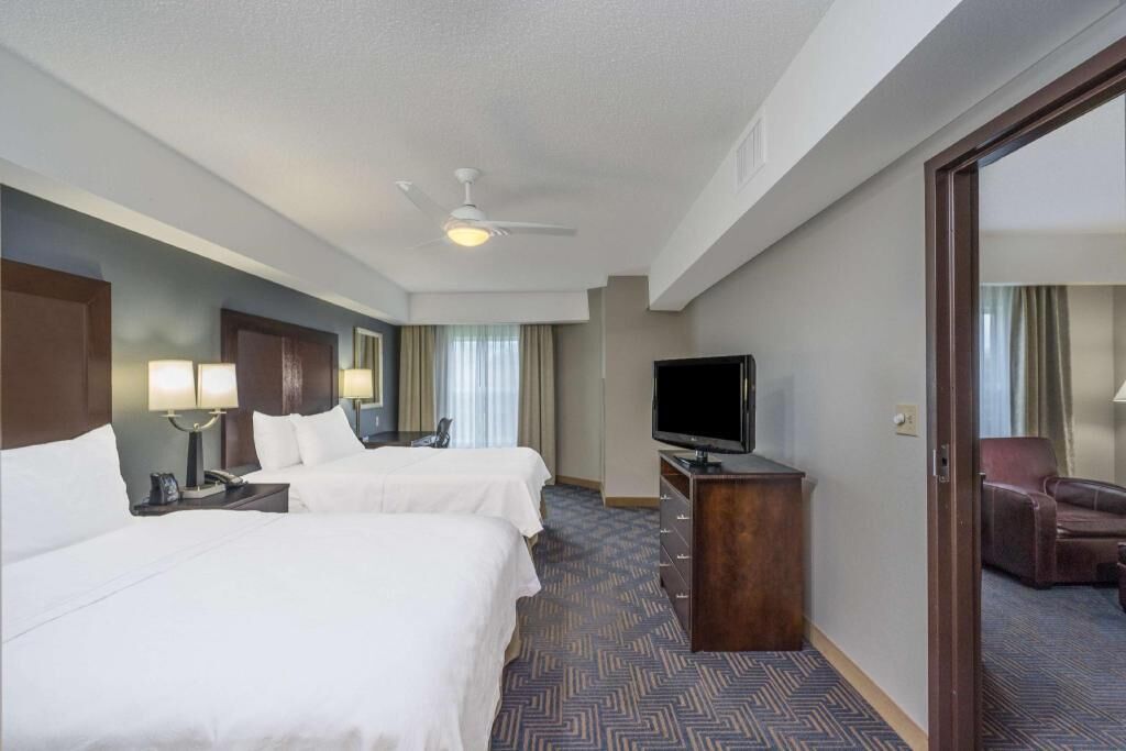 Premium bedding, pillow-top beds, desk, laptop workspace